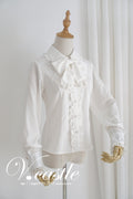 Blouse with large collar and ribbon tie