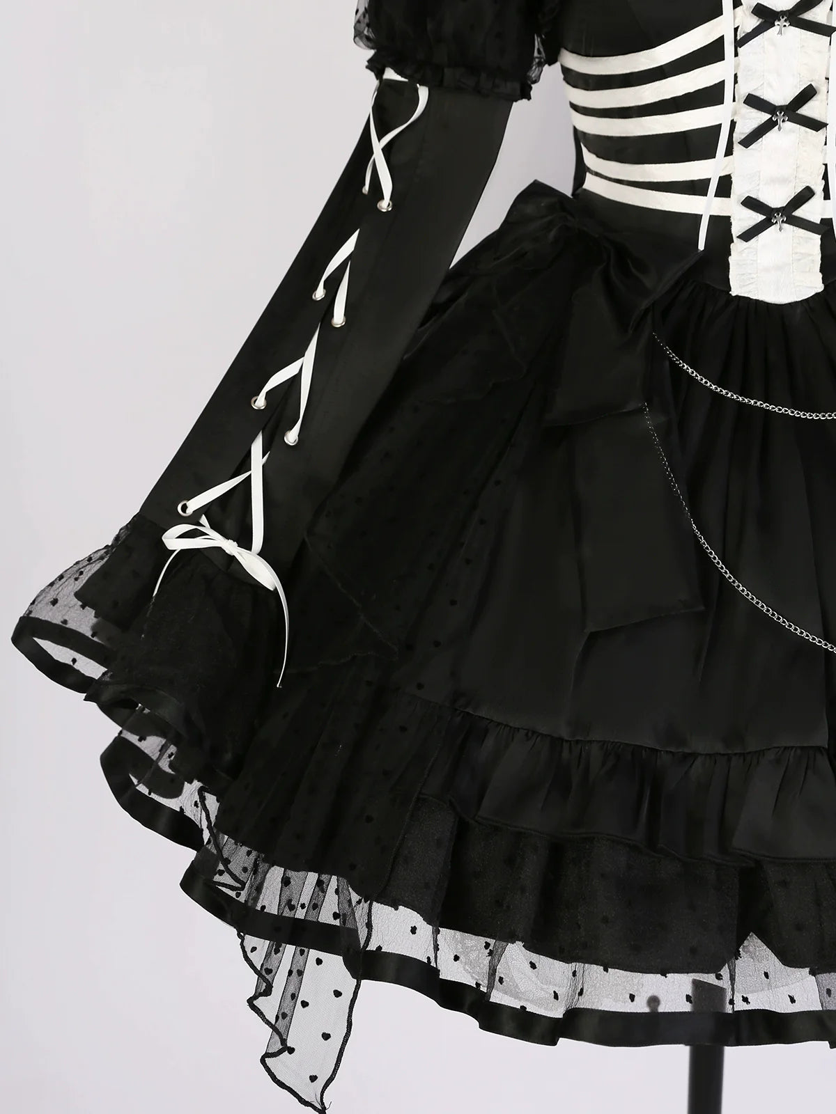Triple ribbon jumper skirt and bolero with rib motif